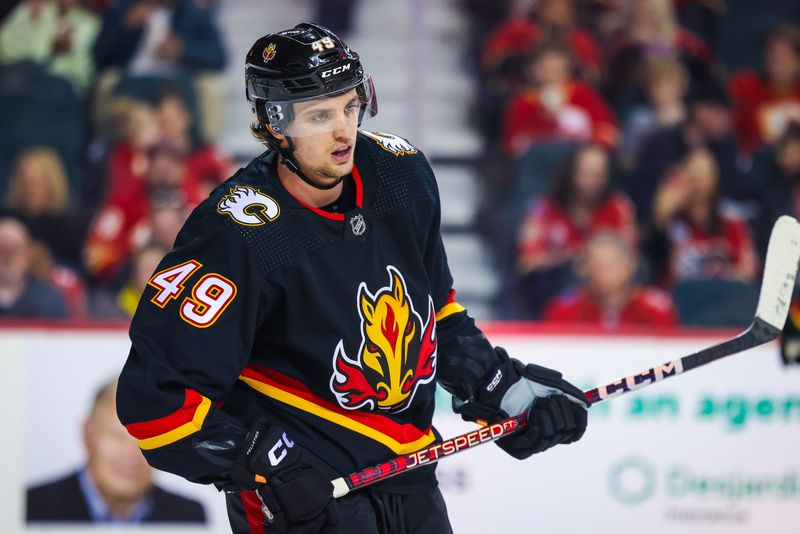 Jan 21, 2023; Calgary, Alberta, CAN; Calgary Flames left wing Jakob Pelletier (49) against the Tampa Bay Lightning during the second period at Scotiabank Saddledome. Mandatory Credit: Sergei Belski-USA TODAY Sports