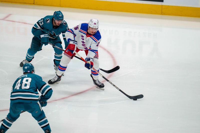 Nov 19, 2022; San Jose, California, USA; New York Rangers left wing Jimmy Vesey (26) controls the puck against San Jose Sharks left wing Matt Nieto (83) during the third period  at SAP Center at San Jose. Mandatory Credit: Neville E. Guard-USA TODAY Sports