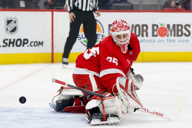 Jan 14, 2025; Detroit, Michigan, USA;  Detroit Red Wings goaltender Ville Husso (35) watches the puck go in for a goal in the first period against the San Jose Sharks at Little Caesars Arena. Mandatory Credit: Rick Osentoski-Imagn Images