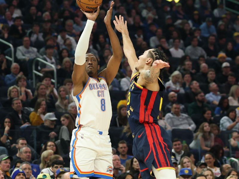 SAN FRANCISCO, CALIFORNIA - NOVEMBER 27: Jalen Williams #8 of the Oklahoma City Thunder takes a shot over Lindy Waters III #43 of the Golden State Warriors during the first half at Chase Center on November 27, 2024 in San Francisco, California. NOTE TO USER: User expressly acknowledges and agrees that, by downloading and or using this photograph, User is consenting to the terms and conditions of the Getty Images License Agreement (Photo by Ezra Shaw/Getty Images)