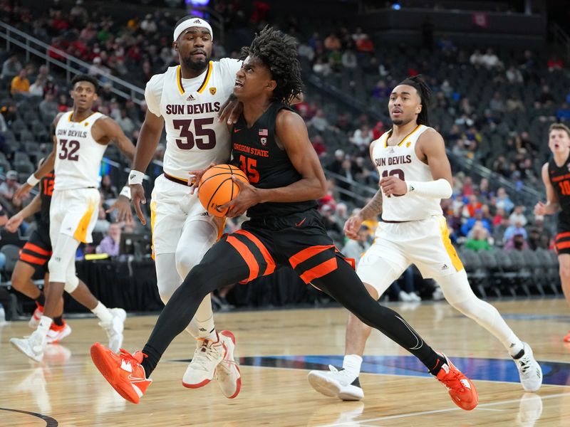 Mar 8, 2023; Las Vegas, NV, USA; Oregon State Beavers forward Glenn Taylor Jr. (35) dribbles against Arizona State Sun Devils guard Devan Cambridge (35) during the second half at T-Mobile Arena. Mandatory Credit: Stephen R. Sylvanie-USA TODAY Sports