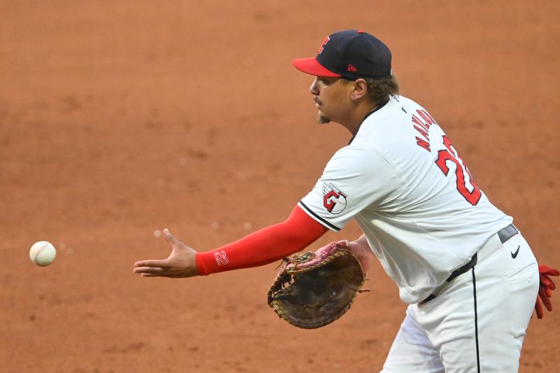 Aug 14, 2024; Cleveland, Ohio, USA; Cleveland Guardians first baseman Josh Naylor (22) tosses the ball to first base in the sixth inning against the Chicago Cubs at Progressive Field. Mandatory Credit: David Richard-USA TODAY Sports