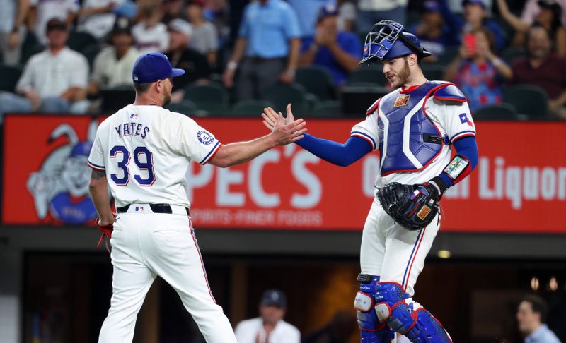 Sep 18, 2024; Arlington, Texas, USA;  Texas Rangers relief pitcher Kirby Yates (39) celebrates with Texas Rangers catcher Jonah Heim (28) after the game against the Toronto Blue Jays at Globe Life Field. Mandatory Credit: Kevin Jairaj-Imagn Images