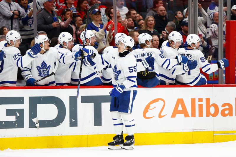 Mar 20, 2024; Washington, District of Columbia, USA; Toronto Maple Leafs left wing Tyler Bertuzzi (59) celebrates after scoring a goal against the Washington Capitals during the third period at Capital One Arena. Mandatory Credit: Amber Searls-USA TODAY Sports