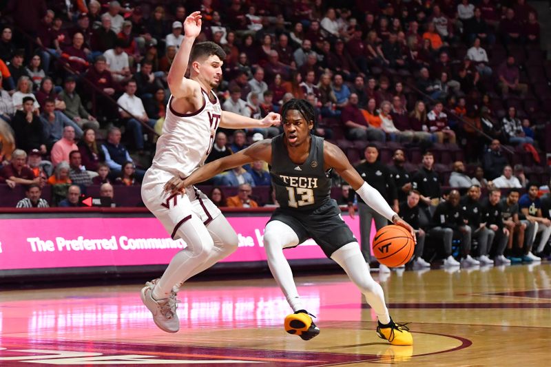 Jan 27, 2024; Blacksburg, Virginia, USA; Georgia Tech Yellow Jackets guard Miles Kelly (13) drives into the lane while being defended by Virginia Tech Hokies guard Hunter Cattoor (0)  during the first half at Cassell Coliseum. Mandatory Credit: Brian Bishop-USA TODAY Sports