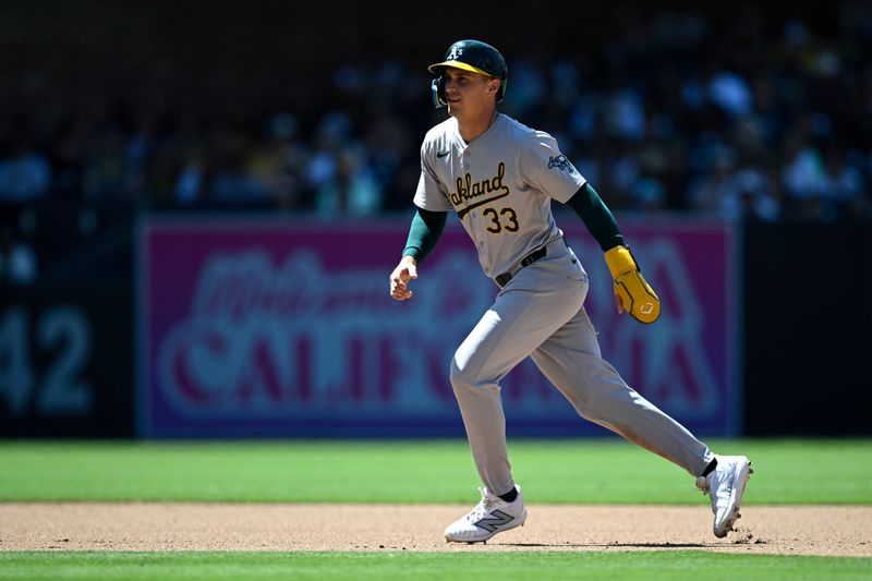 Jun 12, 2024; San Diego, California, USA; Oakland Athletics designated hitter JJ Bleday (33) leads off second base during the seventh inning against the San Diego Padres at Petco Park. Mandatory Credit: Orlando Ramirez-USA TODAY Sports