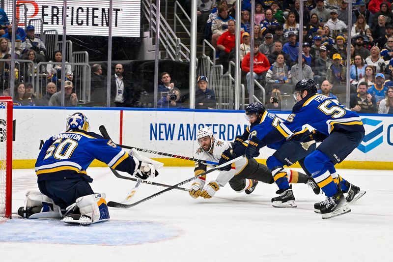 Mar 25, 2024; St. Louis, Missouri, USA;  St. Louis Blues defenseman Justin Faulk (72) defenseman Colton Parayko (55) and goaltender Jordan Binnington (50) defend against Vegas Golden Knights right wing Michael Amadio (22) during the first period at Enterprise Center. Mandatory Credit: Jeff Curry-USA TODAY Sports