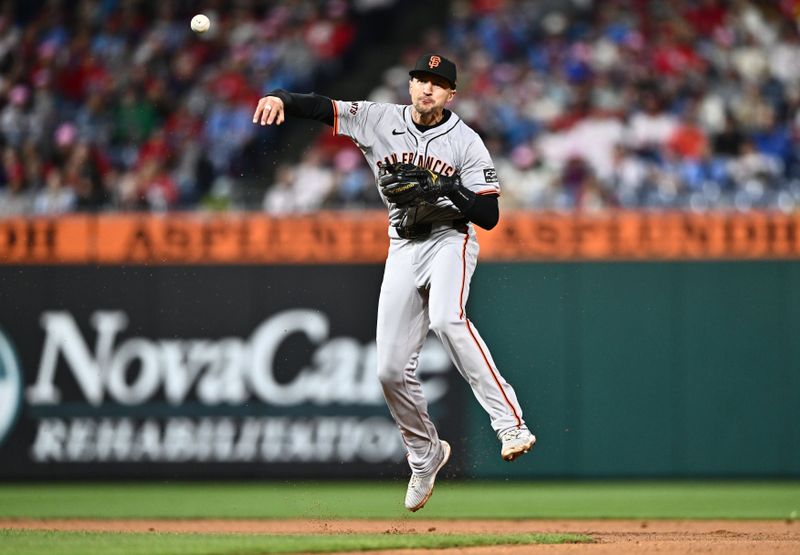 May 5, 2024; Philadelphia, Pennsylvania, USA; San Francisco Giants shortstop Nick Ahmed (16) throws to first against the Philadelphia Phillies in the fourth inning at Citizens Bank Park. Mandatory Credit: Kyle Ross-USA TODAY Sports