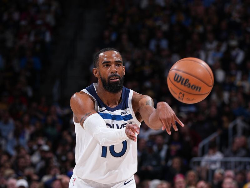 DENVER, CO - APRIL 10: Mike Conley #10 of the Minnesota Timberwolves passes the ball during the game against the Denver Nuggets on April 10, 2024 at the Ball Arena in Denver, Colorado. NOTE TO USER: User expressly acknowledges and agrees that, by downloading and/or using this Photograph, user is consenting to the terms and conditions of the Getty Images License Agreement. Mandatory Copyright Notice: Copyright 2024 NBAE (Photo by Garrett Ellwood/NBAE via Getty Images)