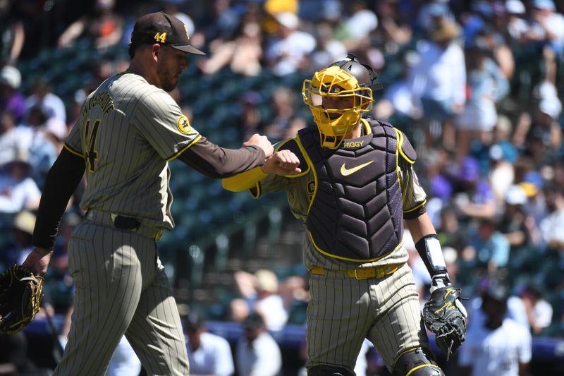 Aug 18, 2024; Denver, Colorado, USA; San Diego Padres pitcher Joe Musgrove (44) is congratulated by catcher Kyle Higashioka (20) after a pickoff out to end the third inning against the Colorado Rockies at Coors Field. Mandatory Credit: Christopher Hanewinckel-USA TODAY Sports