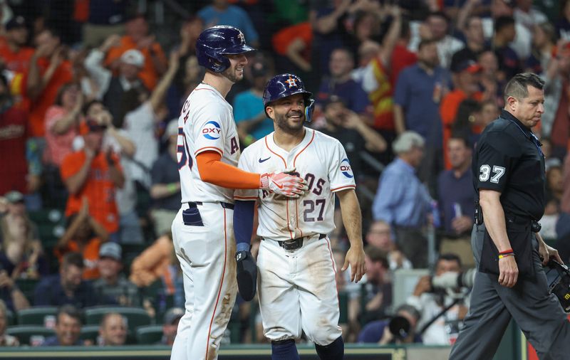 Apr 3, 2024; Houston, Texas, USA; Houston Astros second baseman Jose Altuve (27) reacts with right fielder Kyle Tucker (30) after scoring a run during the fourth inning against the Toronto Blue Jays at Minute Maid Park. Mandatory Credit: Troy Taormina-USA TODAY Sports