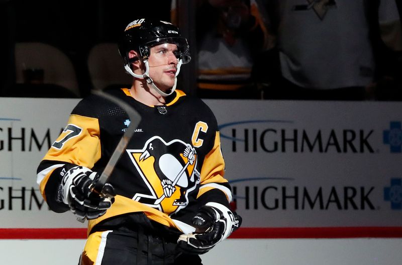 Feb 25, 2024; Pittsburgh, Pennsylvania, USA;  Pittsburgh Penguins center Sidney Crosby (87) reacts after being named first star of the game against the Philadelphia Flyers at PPG Paints Arena. Pittsburgh won 7-6. Mandatory Credit: Charles LeClaire-USA TODAY Sports