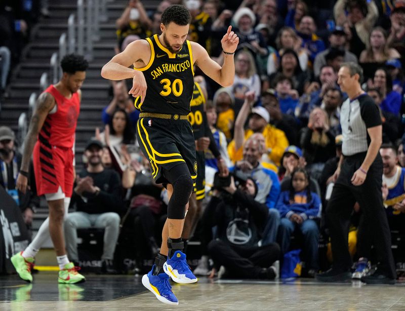 SAN FRANCISCO, CALIFORNIA - DECEMBER 23: Stephen Curry #30 of the Golden State Warriors reacts after scoring and being fouled on the shot against the Portland Trail Blazers during the first half at Chase Center on December 23, 2023 in San Francisco, California. NOTE TO USER: User expressly acknowledges and agrees that, by downloading and or using this photograph, User is consenting to the terms and conditions of the Getty Images License Agreement. (Photo by Thearon W. Henderson/Getty Images)