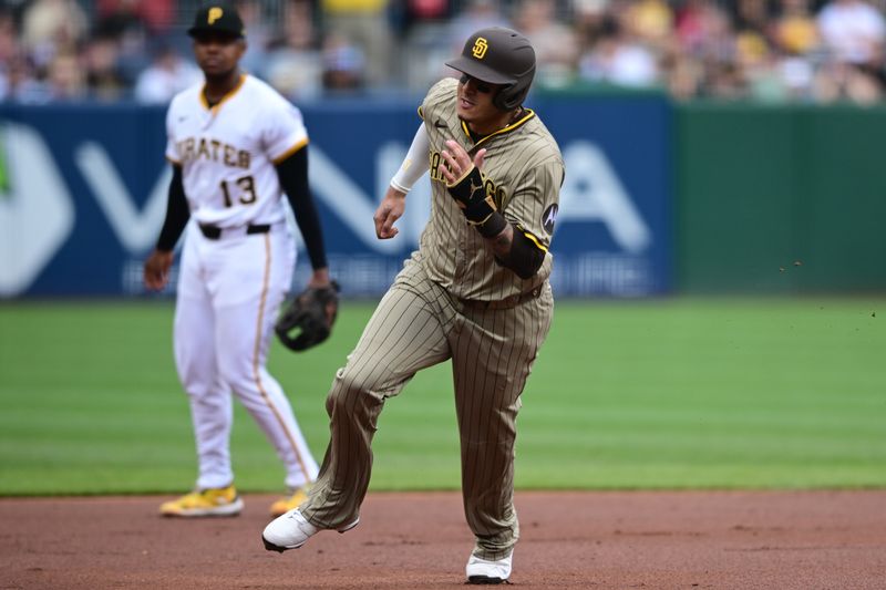 May 4, 2025; Pittsburgh, Pennsylvania, USA; San Diego Padres third baseman Manny Machado (13) runs home to score a run on an RBI single by shortstop Xander Bogaerts (2) during the first inning Pittsburgh Pirates at PNC Park. Mandatory Credit: David Dermer-Imagn Images