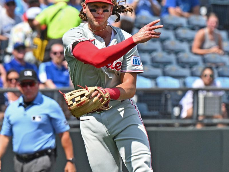 Aug 25, 2024; Kansas City, Missouri, USA;  Philadelphia Phillies third baseman Alec Bohm (28) throws to first base for an out in the second inning against the Kansas City Royals at Kauffman Stadium. Mandatory Credit: Peter Aiken-USA TODAY Sports