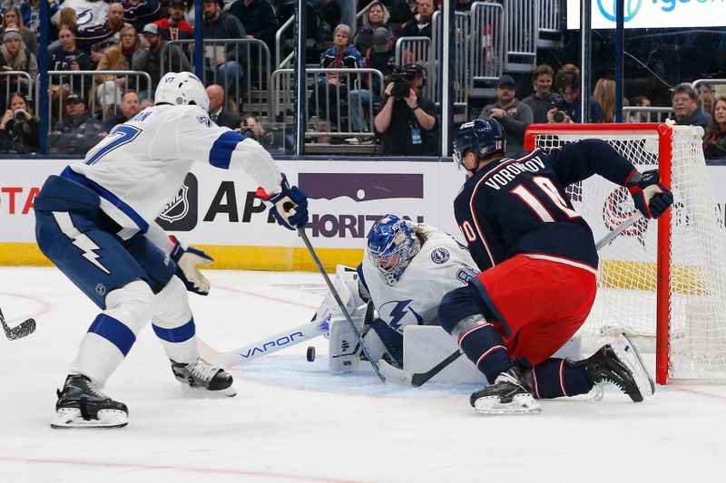 Feb 10, 2024; Columbus, Ohio, USA; Tampa Bay Lightning goalie Andrei Vasilevskiy (88) makes a save as Columbus Blue Jackets left wing Dmitri Voronkov (10) looks for a rebound during the second period at Nationwide Arena. Mandatory Credit: Russell LaBounty-USA TODAY Sports