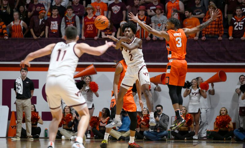 Jan 28, 2023; Blacksburg, Virginia, USA; Virginia Tech Hokies guard Michael Collins Jr. (2) passes to forward John Camden (11) as Syracuse Orange guard Judah Mintz (3) defends play at Cassell Coliseum. Mandatory Credit: Lee Luther Jr.-USA TODAY Sports