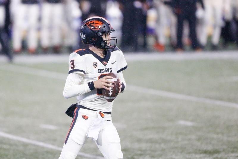 Nov 14, 2020; Seattle, Washington, USA; Oregon State Beavers quarterback Tristan Gebbia (3) looks to pass against the Washington Huskies during the first quarter at Alaska Airlines Field at Husky Stadium. Mandatory Credit: Joe Nicholson-USA TODAY Sports