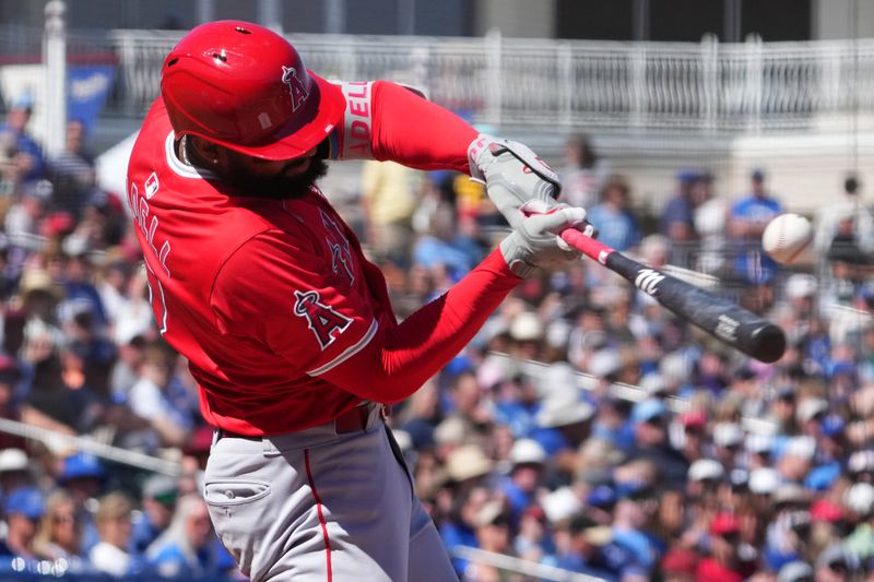 Mar 13, 2024; Surprise, Arizona, USA; Los Angeles Angels right fielder Jo Adell (7) bats against the Kansas City Royals during the third inning at Surprise Stadium. Mandatory Credit: Joe Camporeale-USA TODAY Sports