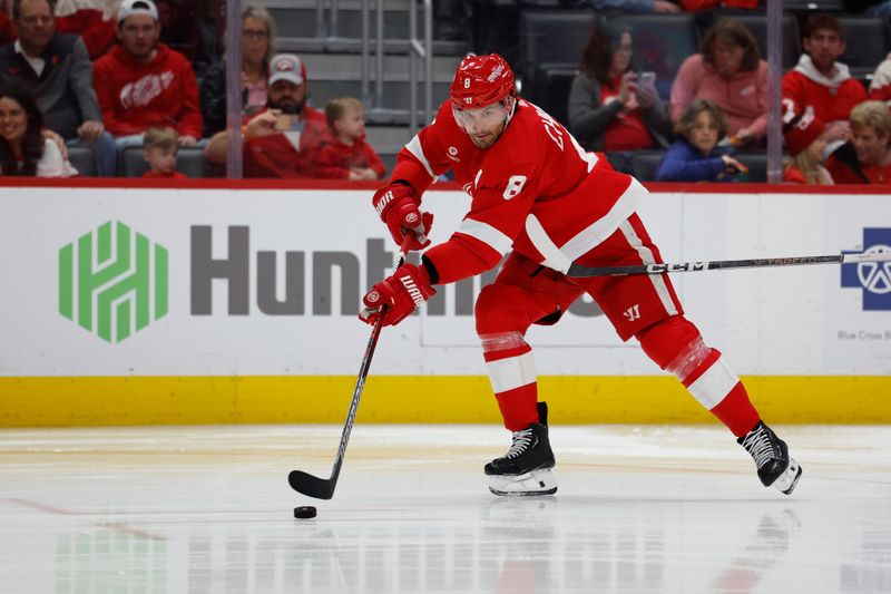 Apr 7, 2024; Detroit, Michigan, USA; Detroit Red Wings defenseman Ben Chiarot (8) skates with the puck in the third period against the Buffalo Sabres at Little Caesars Arena. Mandatory Credit: Rick Osentoski-USA TODAY Sports