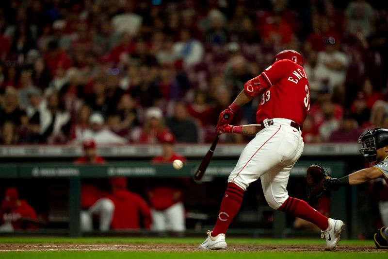 Sep 23, 2023; Cincinnati, Ohio, USA; Cincinnati Reds designated hitter Christian Encarnacion-Strand (33) hits a base hit in the eighth inning against the Pittsburgh Pirates at Great American Ball Park. Mandatory Credit: The Cincinnati Enquirer-USA TODAY Sports