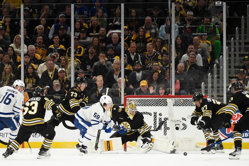 Apr 20, 2024; Boston, Massachusetts, USA; Toronto Maple Leafs left wing Tyler Bertuzzi (59) looks for the puck in front of Boston Bruins goaltender Jeremy Swayman (1) during the third period in game one of the first round of the 2024 Stanley Cup Playoffs at TD Garden. Mandatory Credit: Bob DeChiara-USA TODAY Sports