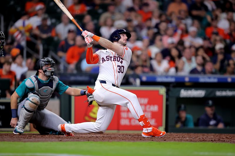 May 5, 2024; Houston, Texas, USA; Houston Astros right fielder Kyle Tucker (30) hits a two-run home run to right field against the Seattle Mariners during the sixth inning at Minute Maid Park. Mandatory Credit: Erik Williams-USA TODAY Sports