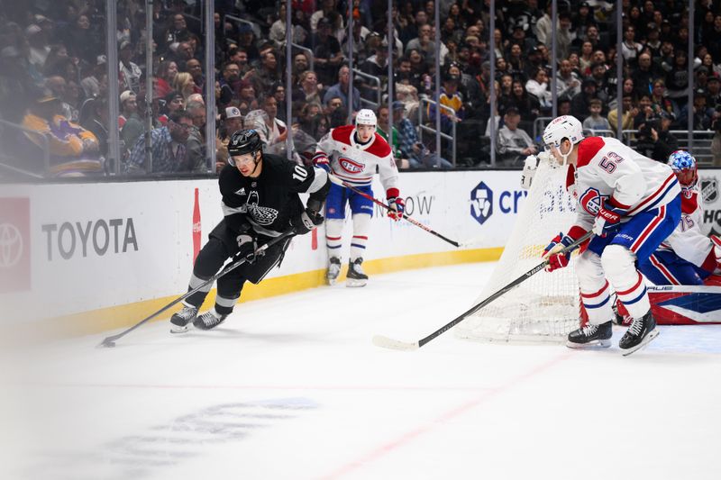Mar 7, 2026; Los Angeles, California, USA; Los Angeles Kings right wing Corey Perry (10) controls the puck while under pressure from Montréal Canadiens defenseman Noah Dobson (53) during the second period at Crypto.com Arena. Mandatory Credit: William Liang-Imagn Images