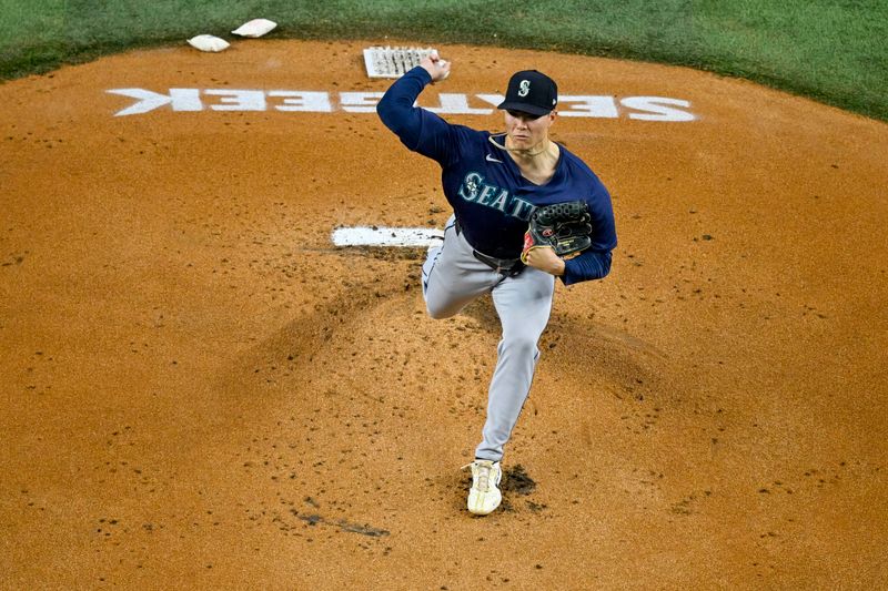 Sep 22, 2024; Arlington, Texas, USA; Seattle Mariners starting pitcher Bryan Woo (22) pitches against the Texas Rangers during the first inning at Globe Life Field. Mandatory Credit: Jerome Miron-Imagn Images