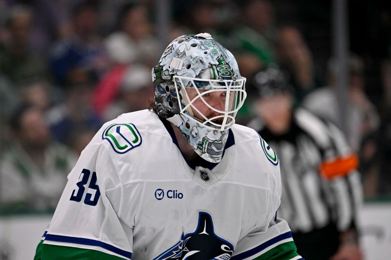 Apr 8, 2025; Dallas, Texas, USA; Vancouver Canucks goaltender Thatcher Demko (35) faces the Dallas Stars attack during the second period at the American Airlines Center. Mandatory Credit: Jerome Miron-Imagn Images