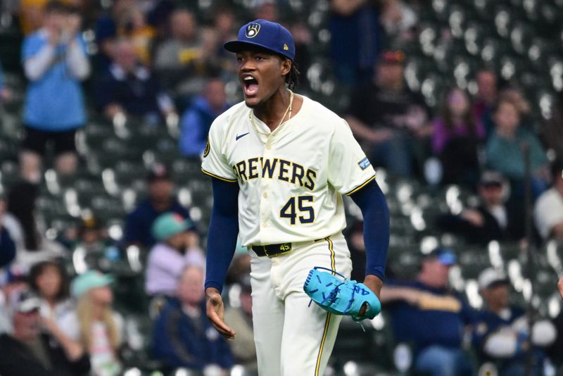 Apr 17, 2024; Milwaukee, Wisconsin, USA;  Milwaukee Brewers pitcher Abner Uribe (45) reacts after getting out of a jam in the eighth inning against the San Diego Padres at American Family Field. Mandatory Credit: Benny Sieu-USA TODAY Sports