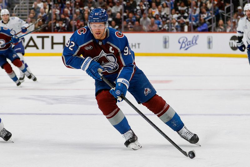 Nov 4, 2025; Denver, Colorado, USA; Colorado Avalanche left wing Gabriel Landeskog (92) controls the puck in the second period against the Tampa Bay Lightning at Ball Arena. Mandatory Credit: Isaiah J. Downing-Imagn Images