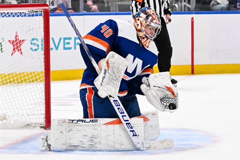 Jan 27, 2024; Elmont, New York, USA; New York Islanders goaltender Semyon Varlamov (40) makes a glove save against the Florida Panthers during the third period at UBS Arena. Mandatory Credit: Dennis Schneidler-USA TODAY Sports