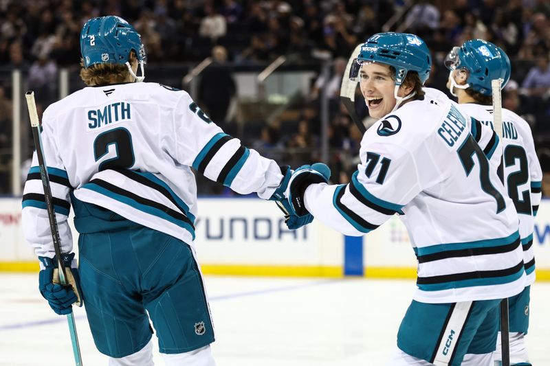 Oct 23, 2025; New York, New York, USA;  San Jose Sharks center Macklin Celebrini (71) celebrates with center Will Smith (2) after scoring a goal in the first period against the New York Rangers at Madison Square Garden. Mandatory Credit: Wendell Cruz-Imagn Images