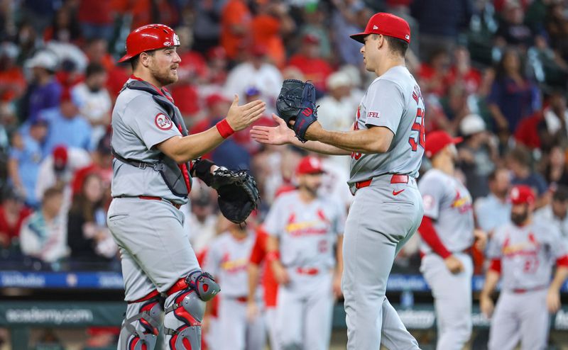 Jun 5, 2024; Houston, Texas, USA; St. Louis Cardinals catcher Pedro Pages (43) and relief pitcher Ryan Helsley (56) celebrate after the game against the Houston Astros at Minute Maid Park. Mandatory Credit: Troy Taormina-USA TODAY Sports