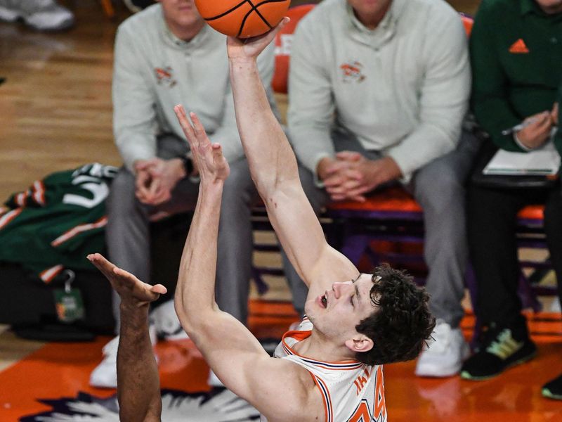 Feb 4, 2023; Clemson, South Carolina, USA;  Clemson sophomore forward PJ Hall (24) shoots around Miami forward Norchad Omier (15) during the first half at Littlejohn Coliseum. Mandatory Credit: Ken Ruinard-USA TODAY Sports