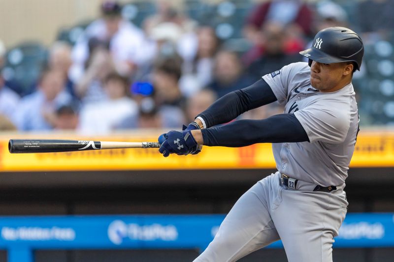 May 14, 2024; Minneapolis, Minnesota, USA; New York Yankees right fielder Juan Soto (22) hits a double against the Minnesota Twins in the first inning at Target Field. Mandatory Credit: Jesse Johnson-USA TODAY Sports