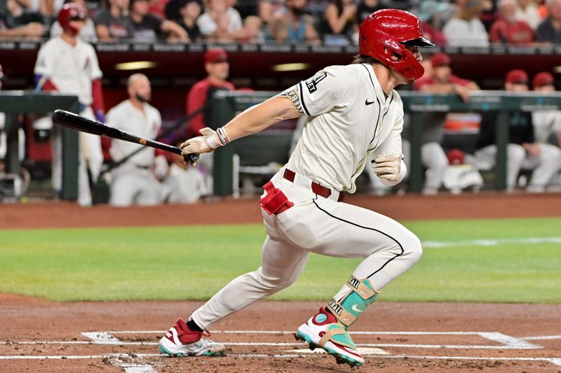 Jun 12, 2024; Phoenix, Arizona, USA; Arizona Diamondbacks outfielder Corbin Carroll (7) singles in the first inning against the Los Angeles Angels at Chase Field. Mandatory Credit: Matt Kartozian-USA TODAY Sports