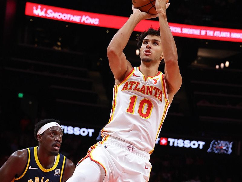 ATLANTA, GEORGIA - OCTOBER 08:  Zaccharie Risacher #10 of the Atlanta Hawks attempts a shot against the Indiana Pacers during the first quarter at State Farm Arena on October 08, 2024 in Atlanta, Georgia.  NOTE TO USER: User expressly acknowledges and agrees that, by downloading and/or using this photograph, user is consenting to the terms and conditions of the Getty Images License Agreement.  (Photo by Kevin C. Cox/Getty Images)