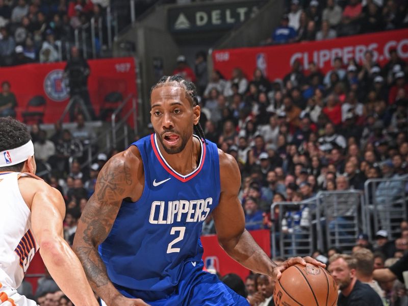 LOS ANGELES, CA - JANUARY 8: Kawhi Leonard #2 of the LA Clippers dribbles the ball during the game against the Phoenix Suns on January 8, 2024 at Crypto.Com Arena in Los Angeles, California. NOTE TO USER: User expressly acknowledges and agrees that, by downloading and/or using this Photograph, user is consenting to the terms and conditions of the Getty Images License Agreement. Mandatory Copyright Notice: Copyright 2024 NBAE (Photo by Andrew D. Bernstein/NBAE via Getty Images)
