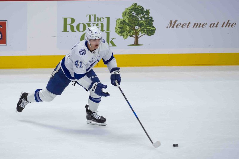 Oct 19, 2024; Ottawa, Ontario, CAN; Tampa Bay Lightning right wing Mitchell Chaffee (41) skates with the puck in the third period against the Ottawa Senators at the Canadian Tire Centre. Mandatory Credit: Marc DesRosiers-Imagn Images