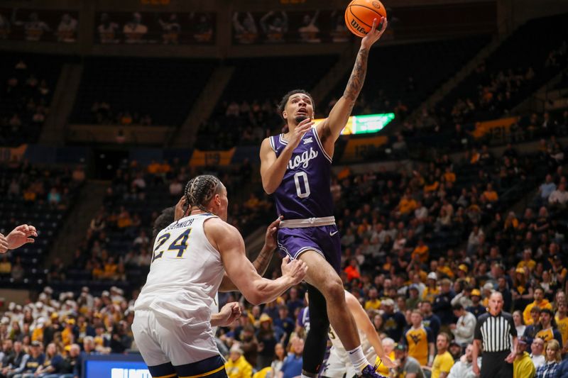 Mar 6, 2024; Morgantown, West Virginia, USA; TCU Horned Frogs guard Micah Peavy (0) shoots in the lane during the first half against the West Virginia Mountaineers at WVU Coliseum. Mandatory Credit: Ben Queen-USA TODAY Sports