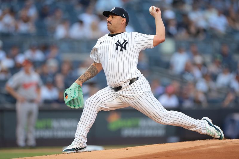 Jun 18, 2024; Bronx, New York, USA; New York Yankees starting pitcher Nestor Cortes (65) delivers a pitch during the first inning against the Baltimore Orioles at Yankee Stadium. Mandatory Credit: Vincent Carchietta-USA TODAY Sports