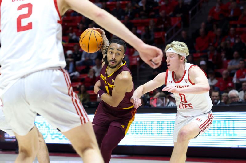 Feb 10, 2024; Salt Lake City, Utah, USA; Arizona State Sun Devils guard Frankie Collins (1) drives to the basket against Utah Utes guard Hunter Erickson (0) during the first half at Jon M. Huntsman Center. Mandatory Credit: Rob Gray-USA TODAY Sports