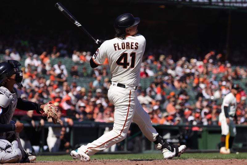 Sep 13, 2023; San Francisco, California, USA; San Francisco Giants first baseman Wilmer Flores (41) hits an RBI single during the seventh inning against the Cleveland Guardians at Oracle Park. Mandatory Credit: Sergio Estrada-USA TODAY Sports