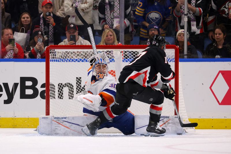 Nov 1, 2024; Buffalo, New York, USA;  New York Islanders goaltender Ilya Sorokin (30) makes a save on a penalty shot by Buffalo Sabres left wing Jason Zucker (17) during the third period at KeyBank Center. Mandatory Credit: Timothy T. Ludwig-Imagn Images