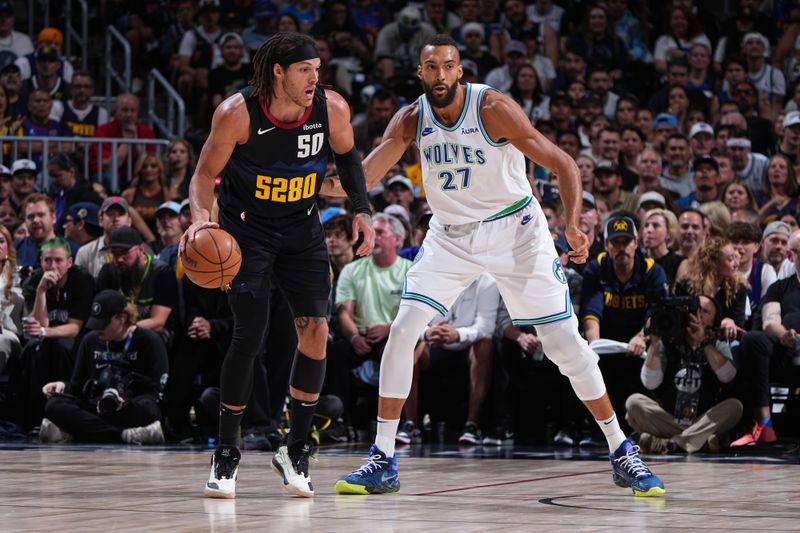 DENVER, CO - MAY 19:  Rudy Gobert #27 of the Minnesota Timberwolves plays defense during the game  against Aaron Gordon #50 of the Denver Nuggets during Round 2 Game 7 of the 2024 NBA Playoffs  on May 19, 2024 at the Ball Arena in Denver, Colorado. NOTE TO USER: User expressly acknowledges and agrees that, by downloading and/or using this Photograph, user is consenting to the terms and conditions of the Getty Images License Agreement. Mandatory Copyright Notice: Copyright 2024 NBAE (Photo by Garrett Ellwood/NBAE via Getty Images)