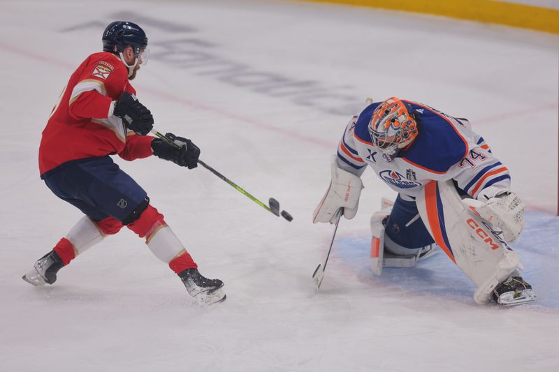 Jun 9, 2025; Sunrise, Florida, USA; Florida Panthers forward Sam Bennett (9) scores against Edmonton Oilers goaltender Stuart Skinner (74) during the second period in game three of the 2025 Stanley Cup Final at Amerant Bank Arena. Mandatory Credit: Sam Navarro-Imagn Images