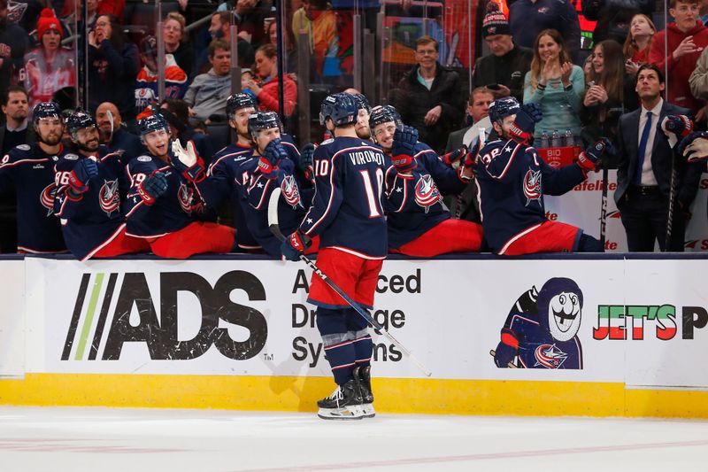 Mar 7, 2024; Columbus, Ohio, USA; Columbus Blue Jackets left wing Dmitri Voronkov (10) celebrates his goal against the Edmonton Oilers during the first period at Nationwide Arena. Mandatory Credit: Russell LaBounty-USA TODAY Sports