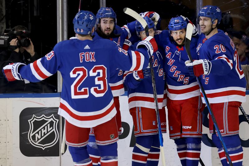 Jan 16, 2024; New York, New York, USA; New York Rangers center Vincent Trocheck (16) celebrates his goal against the Seattle Kraken with teammates during the first period at Madison Square Garden. Mandatory Credit: Brad Penner-USA TODAY Sports